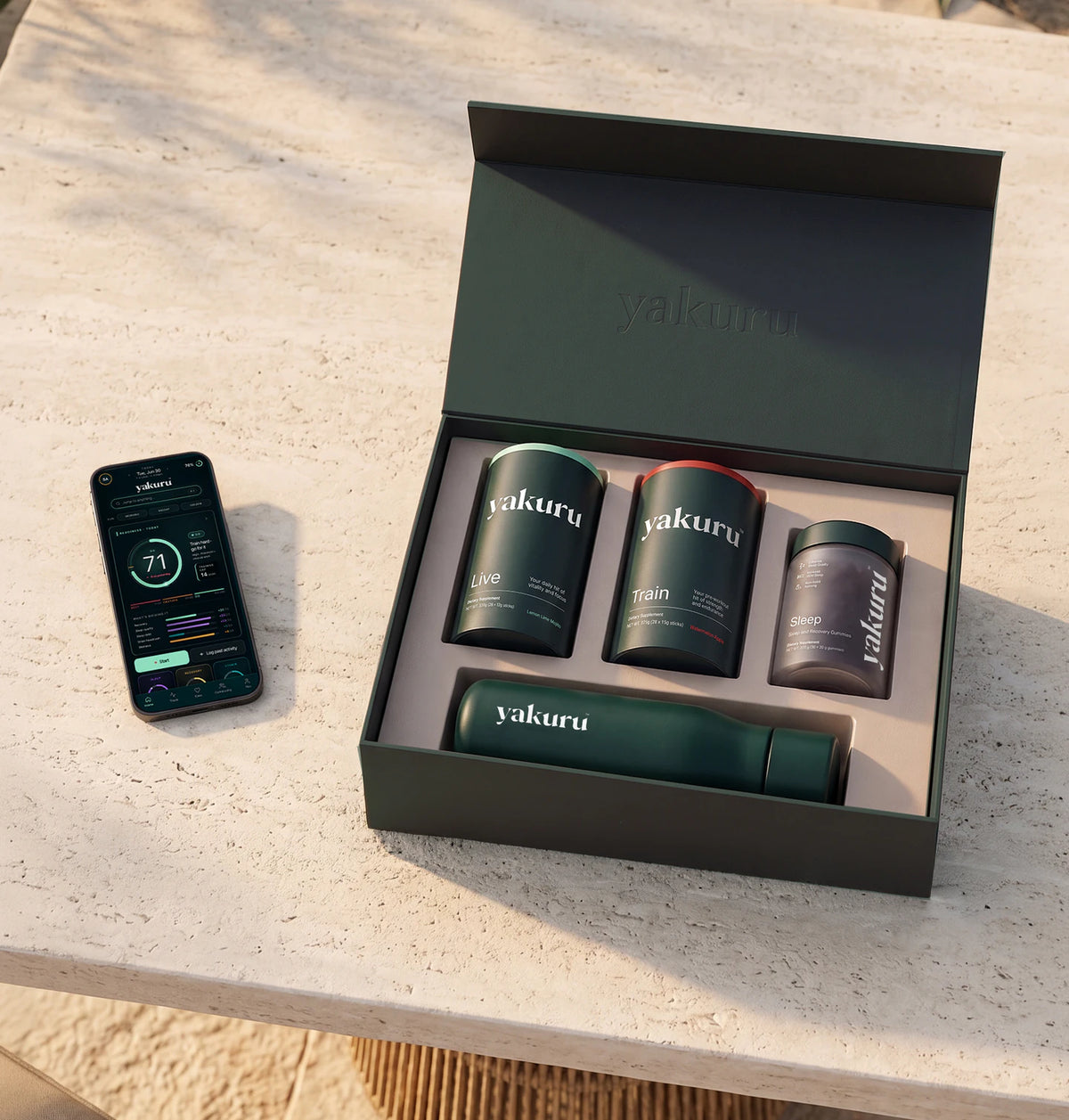 Yakuru Complete Protocol box with Live, Train and Sleep, a water bottle and the app